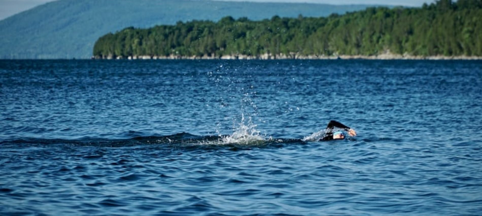 A person swimming in Lake Carlyle