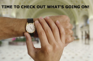 A man adjusting the wristwatch on his left hand. Title: Time to check out what's going on!